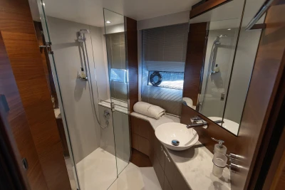 Luxurious 2018 Princess S65 yacht bathroom with modern fixtures and elegant wood accents.