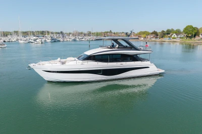 Luxurious 2026 Princess Y72 yacht cruising in a serene marina setting.