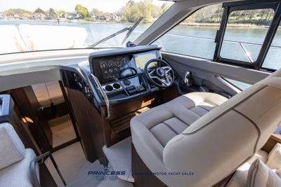 Luxurious 2025 Princess F50 yacht cockpit with modern controls and panoramic view.