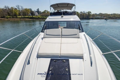 2025 Princess F50 yacht on serene water, showcasing sleek design and luxurious deck.