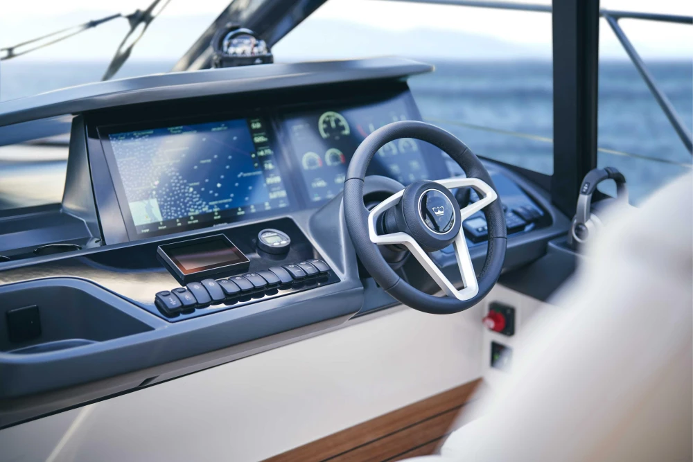 Helm of 2026 Princess V50 Open yacht with advanced navigation display.