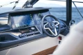 Helm of 2026 Princess V50 Open yacht with advanced navigation display.