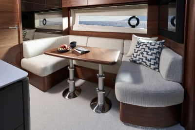 Luxurious interior of 2026 Princess V50 Open yacht with elegant dining area and modern decor.