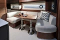 Luxurious interior of 2026 Princess V50 Open yacht with elegant dining area and modern decor.