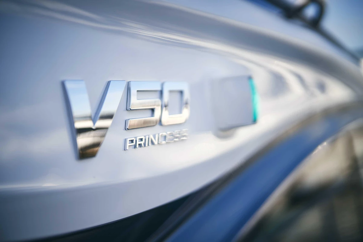2026 Princess V50 Open yacht emblem close-up with sleek design.