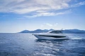 2026 Princess V50 Open yacht cruising on a sunny day with scenic mountain backdrop.