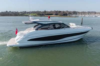 2026 Princess V50 Open yacht cruising on calm waters, showcasing sleek design and luxury features.