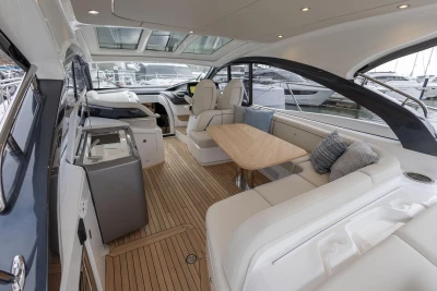 Luxurious interior of 2026 Princess V50 Open yacht with elegant seating and modern design.