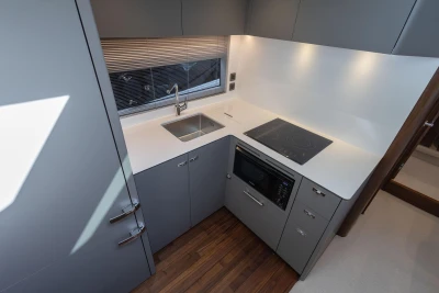 Modern kitchen in 2026 Princess V50 Open yacht with sleek cabinetry and appliances.