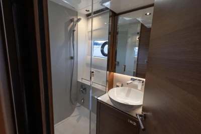 Modern bathroom interior on 2026 Princess V50 Open yacht, featuring sleek design and fixtures.