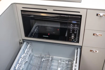 Built-in Samsung microwave and dishwasher in Princess V50 Open 2026 yacht kitchen.