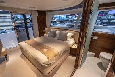 Luxurious bedroom interior of 2026 Princess X80 yacht with modern design and elegant furnishings.