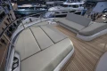 Luxurious deck seating on 2026 Princess X80 yacht at a boat show.