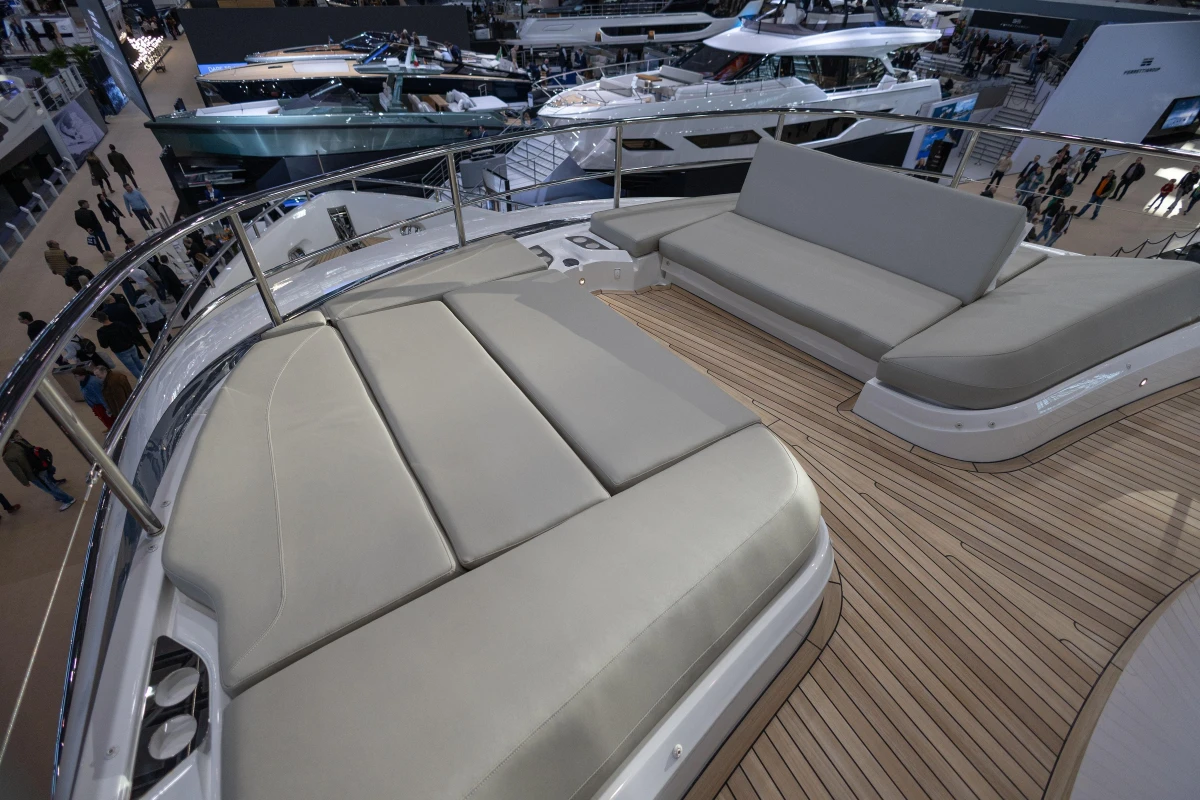 Luxurious deck seating on 2026 Princess X80 yacht at a boat show.