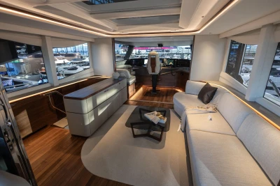 Luxurious interior of 2026 Princess X80 yacht with modern seating and helm station.