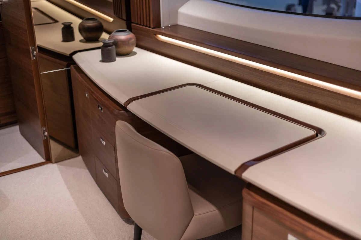 Luxurious interior of 2026 Princess X80 yacht with elegant wooden cabinetry and modern decor.