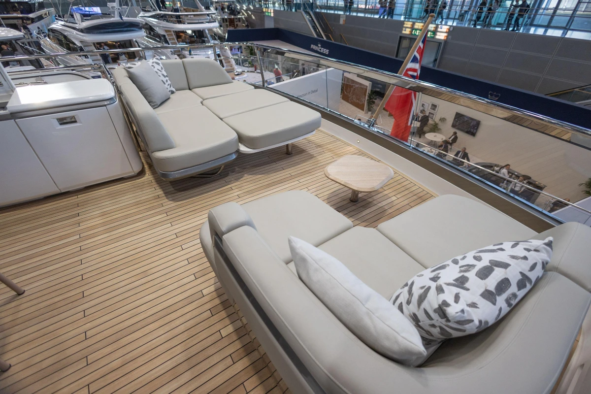 Luxurious deck seating on 2026 Princess X80 yacht with modern design and elegant cushions.