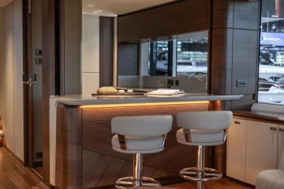 Luxurious interior of 2026 Princess X80 yacht with modern bar and seating.