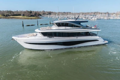 Luxurious 2026 Princess X80 yacht cruising in a serene marina setting.