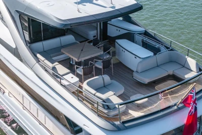 Luxurious 2026 Princess X80 yacht deck with elegant seating and dining area.