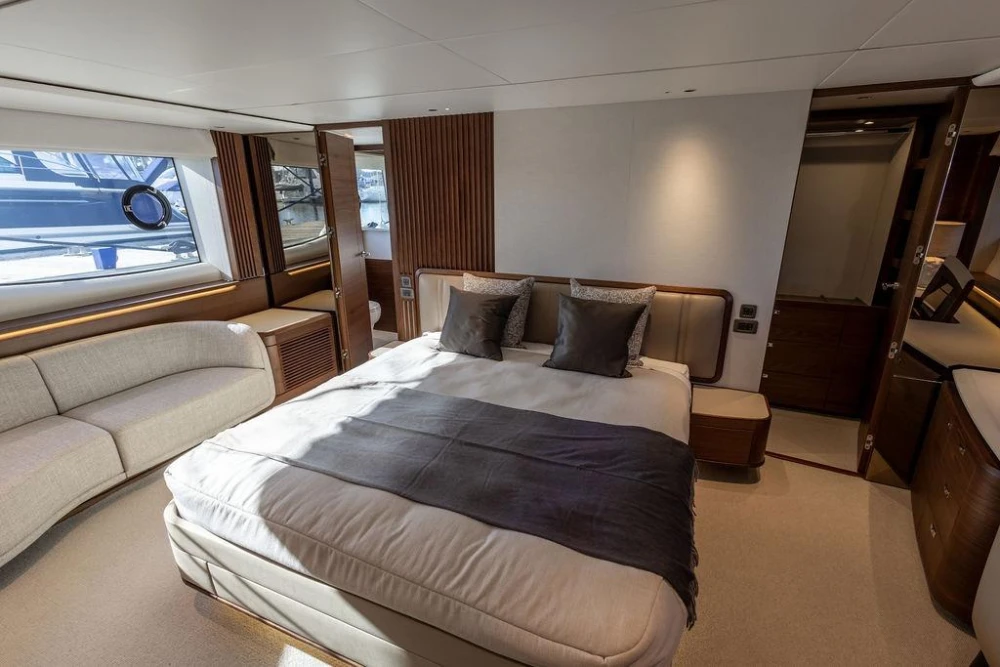 Luxurious 2026 Princess X80 yacht bedroom with elegant decor and modern furnishings.