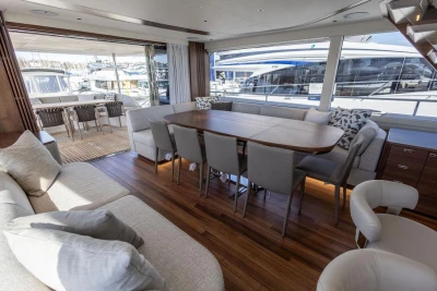 Luxurious interior of 2026 Princess X80 yacht with elegant dining and seating area.