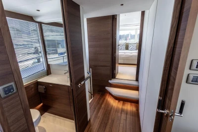 Luxurious interior of 2026 Princess X80 yacht featuring modern bathroom and cozy cabin.