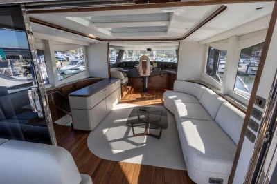 Luxurious interior of 2026 Princess X80 yacht with modern seating and helm station.