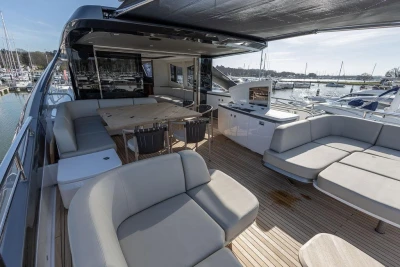 Luxurious 2026 Princess X80 yacht deck with elegant seating and dining area.