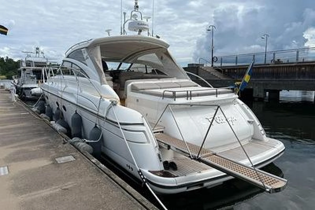2007 Princess V48 yacht docked at marina, featuring sleek design and luxury amenities.