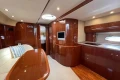 Luxurious interior of 2007 Princess V48 yacht with polished wood and modern amenities.