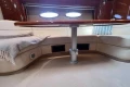 Luxurious 2007 Princess V48 yacht interior with elegant seating and table.