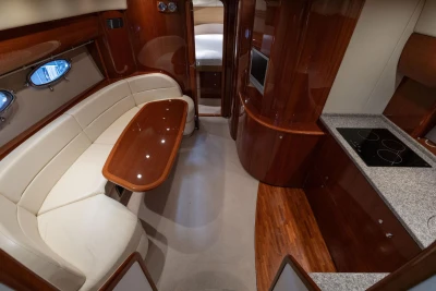 Luxurious 2007 Princess V48 yacht interior with elegant wood finishes and modern amenities.