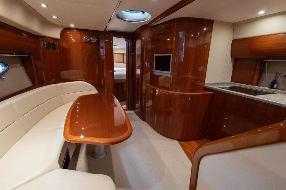 Luxurious 2007 Princess V48 yacht interior with elegant wood finishes and modern amenities.