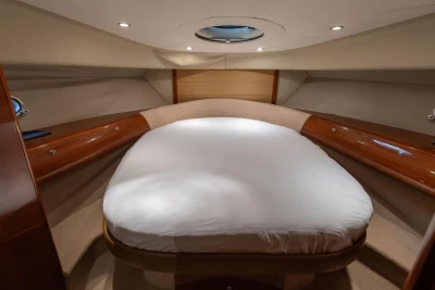 Luxurious cabin interior of 2007 Princess V48 yacht with elegant wood finish.