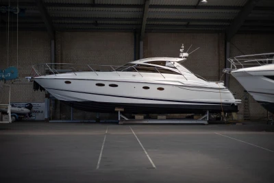2007 Princess V48 yacht in indoor storage, side view.
