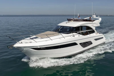 Luxury 2022 Princess F50 yacht cruising on open water.