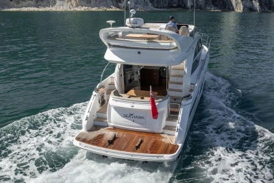 Luxury Princess F50 yacht cruising on water, 2022 model, rear view.