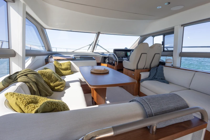 Luxurious interior of 2022 Princess F50 yacht with elegant seating and panoramic windows.