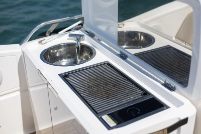 Outdoor kitchen on 2022 Princess F50 yacht with sink and grill.