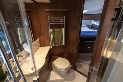 Luxurious bathroom and bedroom interior of 2022 Princess F50 yacht.