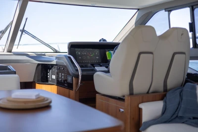Luxurious 2022 Princess F50 yacht interior with modern helm and seating.