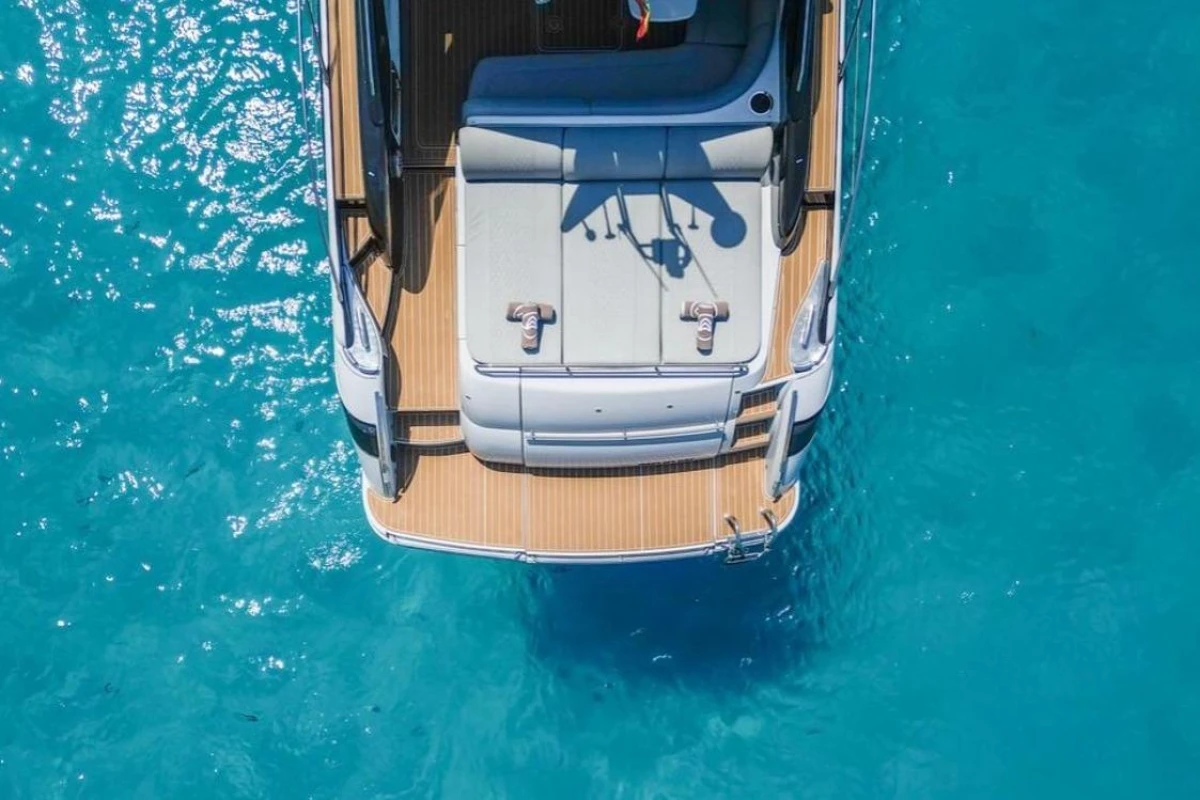 Aerial view of 2005 Princess V58 yacht on clear blue water.