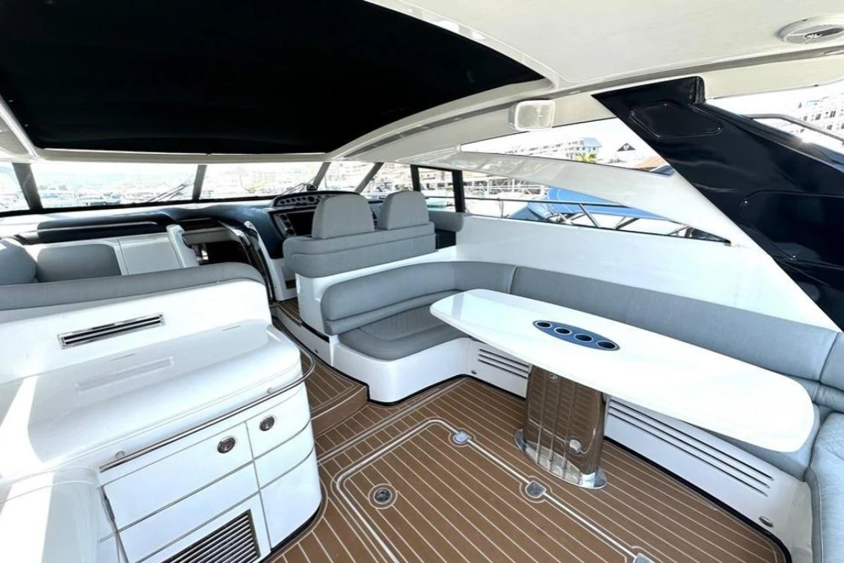 Luxurious interior of 2005 Princess V58 yacht with sleek seating and modern design.