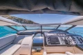 Interior view of 2005 Princess V58 yacht cockpit with scenic ocean backdrop.