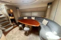 Luxurious interior of 2005 Princess V58 yacht with elegant seating and wooden table.