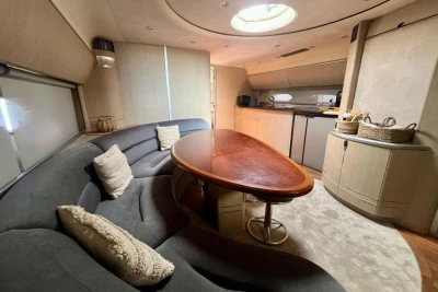 Luxurious 2005 Princess V58 yacht interior with elegant seating and modern kitchen amenities.