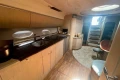 Luxurious interior of 2005 Princess V58 yacht with modern kitchen and dining area.