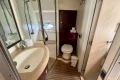 Luxurious bathroom in 2005 Princess V58 yacht with modern fixtures and elegant design.
