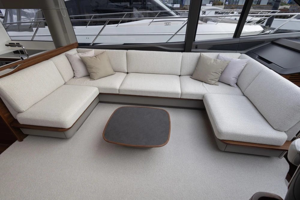 Luxurious interior of 2025 Princess S65 yacht with elegant seating and modern design.